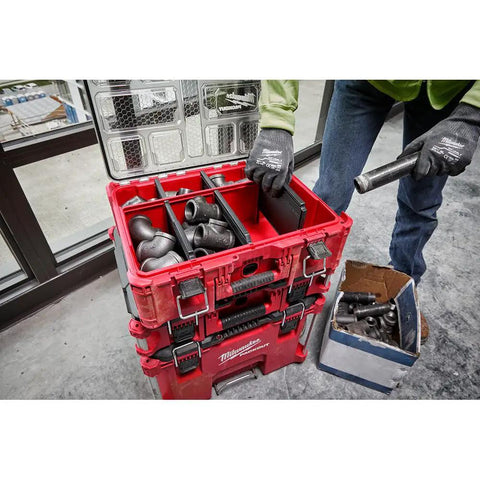 Top Shelf Tool Storage Crate Built Like A Tank For Milwaukee Packout Compatibility Featuring A No Nonsense Fifty Pound Weight Rating And Slick IP65 Weatherproof Shield For Your Daily Grind And Heavy Equipment showcasing organized tools inside in a work setting.