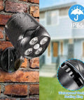 Motion Sensor Outdoor Lights Cordless Battery Powered Two Pack With 1000LM LED Security Light mounted on wet brick wall