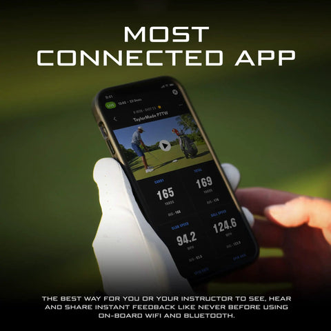 Portable Golf Launch Monitor And Simulator With 5D AI Radar app interface on smartphone display outdoors.