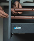 Person installing Top Shelf 12 Inch Side Mounted Plastic Drawer Slides With Mounting Screws Smooth Glide Cabinet Guide Rails Brown.