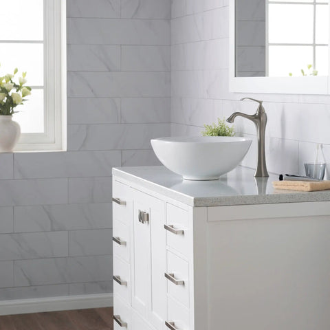 Elavo Round Vessel White Porcelain Ceramic Bathroom Sink 16 Inch for Modern Bathrooms on marble countertop near window