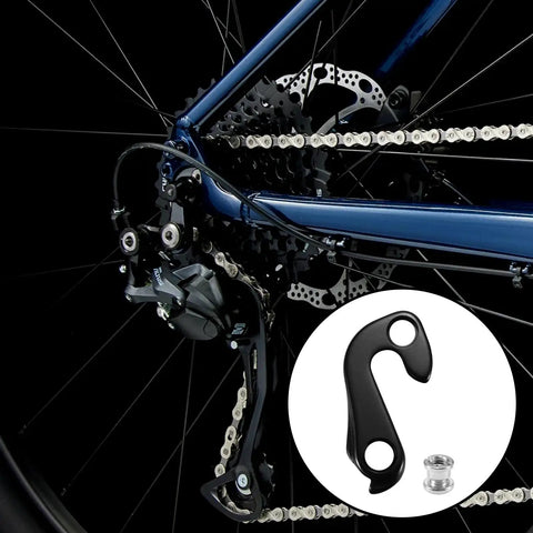 Derailleur Hanger Replacement Part For Trek FX And Dual Sport Bikes Aluminum Alloy shown next to installed bike setup.