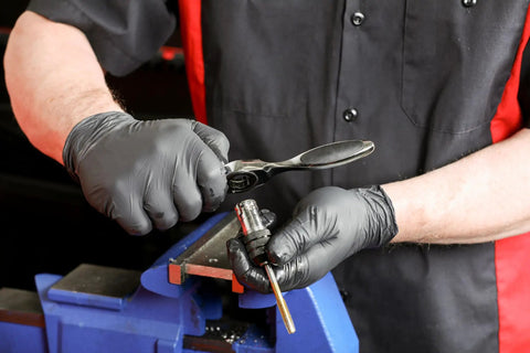 Person using Master Ratcheting Tap And Die Set With Metric And SAE Sizes For Creating And Repairing Threads Titanium Coated Finish