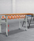 Heavy Duty Adjustable Gravity Roller Table With Rolling Caster Wheels Expandable Extendable Conveyor Belt For Moving Heavy Loads Easy Folding Storage with orange support.