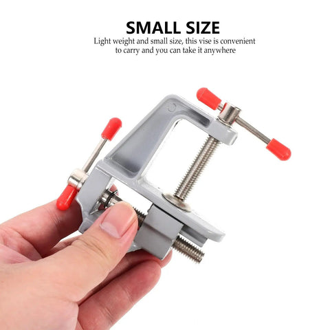Person holding Dope Mini Aluminum Bench Vise Clamp For Jewelry Crafting Woodworking And Hobby Projects Portable Table Repair Tool Compact Workholding Device For Edges Of Desk