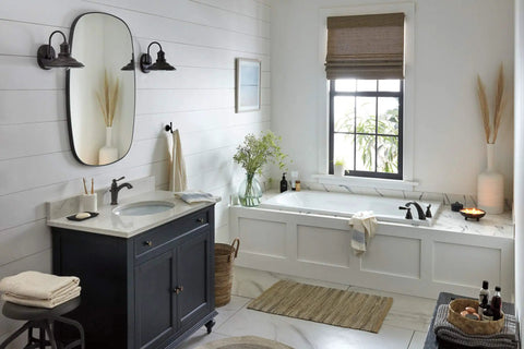 Bathroom featuring the Elmhurst Handle Bath Faucet Oil Rubbed Bronze For One Or Three Hole Four Inch Install Includes Optional Deck Plate And Fifty Fifty Pop Up Drain ADA Compliant And WaterSense Labeled For Efficient Water Use.