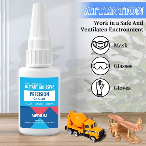 Bottle of Pro Grade Medium CA Glue For Metal And Stone Quick Dry Adhesive with toy construction vehicles and safety instructions.