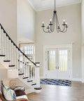 Entrance hall with Black Six Light Farmhouse Chandelier With Candle Style Bulbs For Dining Room Bedroom And Living Room 28 Inch Wide And 24 And A Half Inch High Open Frame Iron Arms For A Dope Modern Rustic Look