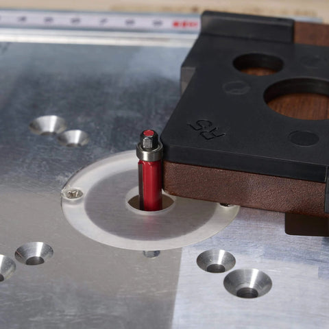 Close-up of Radius Jig Router Templates 4 Pack With 8 Radius Sizes For Woodworking, ABS construction, mounted on router table.