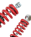 Close-up of red coiled 250mm Adjustable Shock Absorber For 50cc 125cc Dirt Pit Bikes ATVs Go Karts Front And Rear Suspension