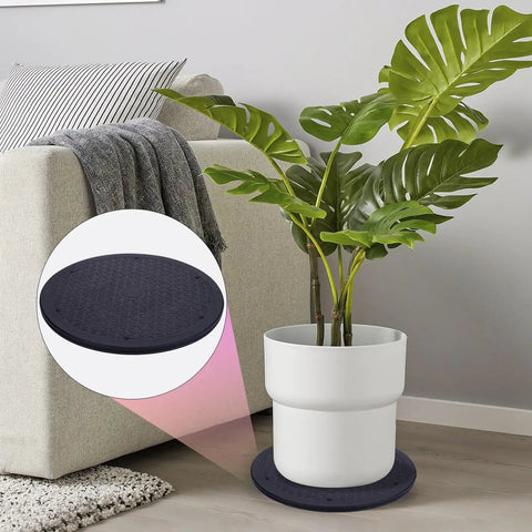 12 Inch Lazy Susan Turntable Organizer with heavy duty rotating swivel stand under potted plant, showing steel ball bearings