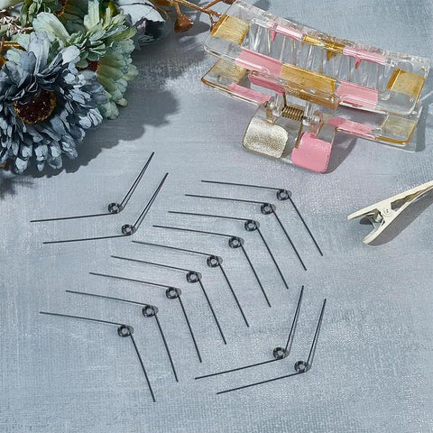 30 Pcs Stainless Steel Torsion Springs 0.5mm Wire Diameter 4.5mm Outer Diameter 120 Degree Deflection arranged on table.