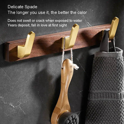 Solid Heavy Duty Wall Mounted Coat Rack Kit With Five Slick Hooks For Entryway Bathroom Organization No Sweat Storage Setup For Jackets Hats Keys Everyday Use with gold hooks on wood backdrop.