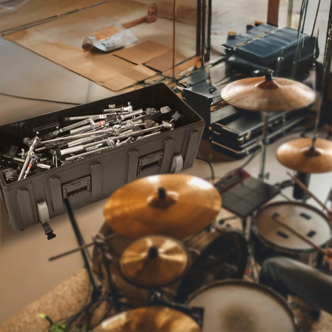Road Ready Drum Hardware Case With Wheels And Telescoping Handle Featuring Hella Durable Roto Molded Polyethylene Construction Secure Cinch Straps For Stands Pedals And Gear Hauling Black filled with drum hardware in studio setting.