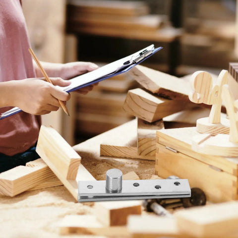 Beefed Up Stainless Steel Pivot Door Hinges For Wood Doors 2 Pack 360 Degree Rotation hardware on workshop table with worker