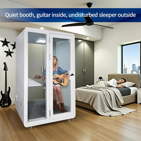 Rock Solid Soundproof Office Pod Featuring Tight Acoustic Sealing For Mobile Focus Booth with musician inside and sleeper outside.