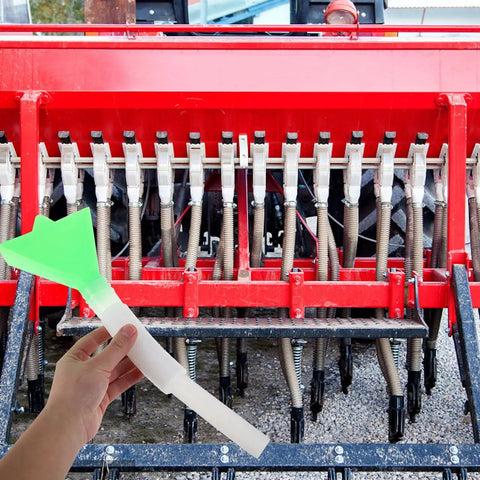 Efficient Seed Distribution Tube For Wheat And Corn Plastic Accessory With Wide Green Funnel Top shown by red planter
