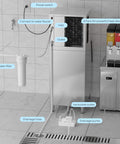 Commercial Ice Maker Machine For Restaurants And Bars Big Industrial Freestanding Stainless Steel Ice Machine That Cranks Out 550 Lbs Per Day With 400 Lbs Storage Ice Ready In 7 To 12 Minutes Clear Cube Ice Energy Efficient Copper Compressor in tile-floored room with water connections.