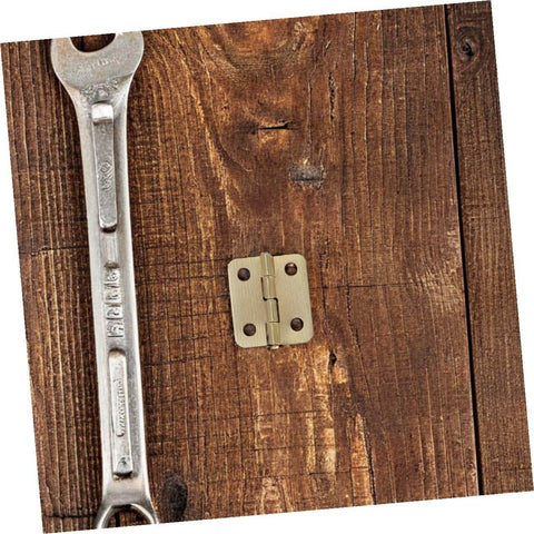 40-Pc Mini Iron Chest Hinges Set With Screws, 270 Degree Rotation Small Cabinet Hardware For Wooden Jewelry Boxes And Tiny Craft Boxes, Dope Yellow Finish With Rounded Corners, Discreet Yet Durable Hinges KOMBIUDA on wooden surface with wrench