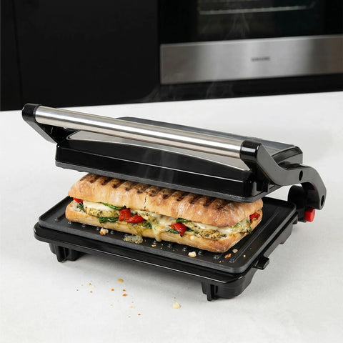 Alpha Living Electric Griddle Panini Press With Non Stick Coating, Stainless Steel 3 In 1 Sandwich Maker grilling a sandwich.