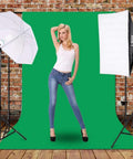Model posing in Go-To Pro Grade Studio Photo Lighting Kit With 2M X 3M Backdrop System, softbox and umbrella lights, green screen setup.