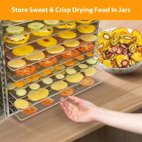 Heavy Hitter Commercial Food Dehydrator With 16 Stainless Steel Trays And 1500 Watts showing drying fruits and vegetables on trays.