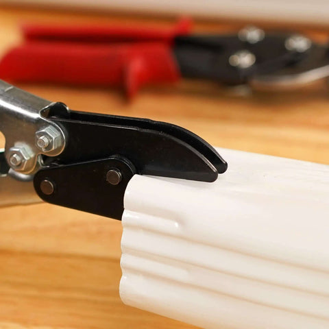 Close-up of 5-Blade Crimper For Straight And Wide Cut Pinch-Thru Point Cutter in use, showing hardened steel blades on downspout pipe