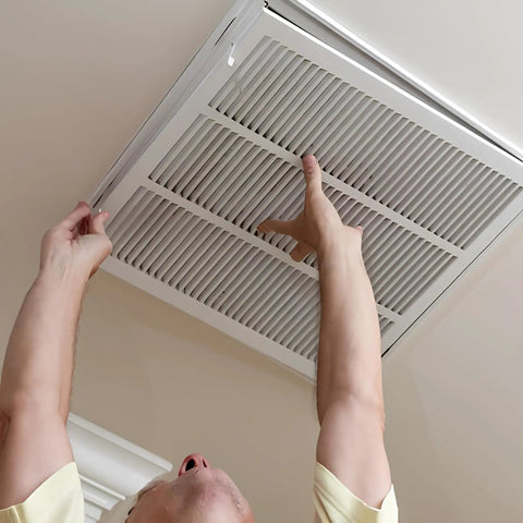 Person installing Return Air Grille for 25 by 20 Duct Opening, Heavy Duty Steel Vent Cover With Fixed Hinged Door in ceiling.