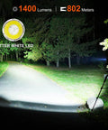 Rechargeable Tactical Flashlight 1400 Lumens With 802 Meter Long Beam Distance illuminating a forest path at night