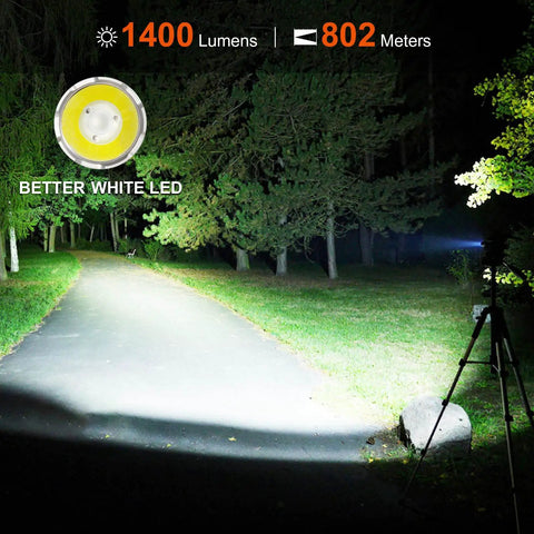 Rechargeable Tactical Flashlight 1400 Lumens With 802 Meter Long Beam Distance illuminating a forest path at night