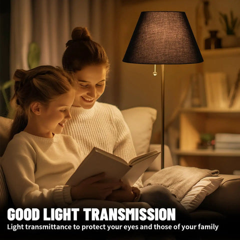 Barrel Style Table Lamp Shade Replacement For Your Home Go To Natural Linen Black Lampshade illuminating a room with book readers