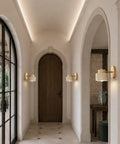 IPEDWO Yellow Travertine Wall Sconce with Natural Wood,4.7" Single Sconce in hallway featuring warm light and wooden accents.