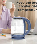 Glass Electric Kettle With No Plastic Contact With Water 1.8L Borosilicate Glass Teapot on desk near laptop