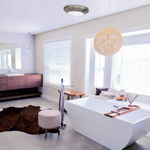 Integrated LED Light Bath Fan With Ceiling Mount Exhaust Quiet One Point One Sones Eighty CFM Brushed Nickel Finish Moisture Control in modern bathroom