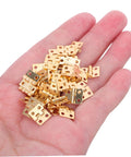 Hand holding Tiny Brass Door Hinges 8x10mm Set Of 100 for jewelry boxes and DIY projects, vintage style.