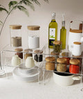 Heavy Duty 2 Pack Stackable Kitchen Counter Spice Rack And Cabinet Organizer Shelf Featuring Clear Plastic Base With Sturdy Stainless Steel Supports For Pantry Bathroom Vanity Organization That Truly Slaps with spices and jars.