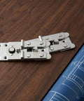 Close-up of heavy duty interlocking sectional sofa connectors 6 pack rust resistant furniture clips and galvanized steel fasteners.