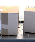 Boxes on conveyor with 32-Piece 1 Inch Roller Ball Transfer Bearing Set With Flange Mounted Carbon Steel Round Ball Transfer Units