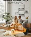 Indoor Space Heater Portable PTC Desktop Heater With 2 Second Fast Heat warming a couple and dog in a cozy living room scene.