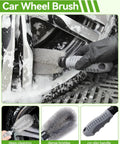 Car wheel brush with dense bristles and no-slip handle cleaning a sudsy car wheel.