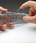 Hands assembling Hindenburg LZ129 1 to 1000 Scale Photo Etched Stainless Steel Model Kit, showcasing intricate etched components.
