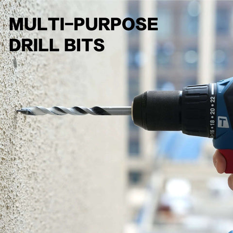 GMTOOLS 10-piece masonry drill bit set (1/8–1/2 in) with carbide tips mounted in a cordless drill against concrete.
