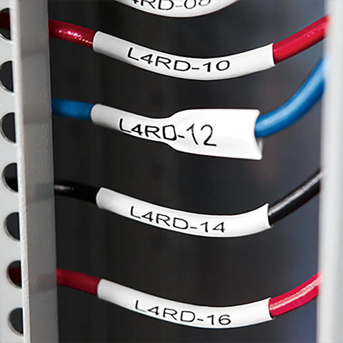 Badass Industrial Heat Shrink Labels Half Inch Tube With Black Print On White marking various wires in electrical panel.