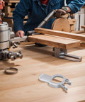 Lever Clamp Replacement For Oscillating Multi Tools Quick Release ABS Mount on a workshop table with woodworking tool