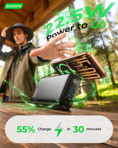 Ultra 50000mAh Portable Charger With PD 22.5W Fast Charging And Hella Solid Power Bank in outdoor setting, charging smartphone.