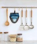 Hot Kitchen Gear Mini Oven Mitts With Non Slip Silicone Grip And Heat Resistant Cotton Padding For Safely Handling Pans Pots And Baking Trays Up To 500 Degrees F hanging with kitchen utensils.