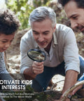 Person using a magnifying glass to examine nature with children, promoting outdoor learning and discovery.