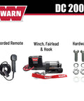 Component layout of 2000 Lb 12V Electric Winch with steel cable, hook, corded remote, and hardware.
