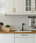 Antique Brass Cabinet Pulls Five Inch Hole Centers Ten Pack Zinc Alloy on white kitchen cabinets