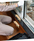 Heavy Duty Barn Door Roller Kit Includes Two Rock Solid Aluminum Sliding Pulley Wheels next to window for smooth installation.